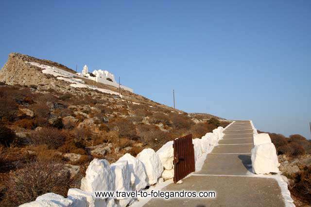 View of Panagia monastery from the pathway on the way up. The church of Virgin Mary dominates the cliff above Chora. FOLEGANDROS PHOTO GALLERY - Panagia by Ioannis Matrozos