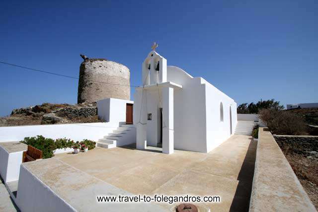 Church and windmill - A small church and a windmill at Ano Meria