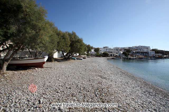 Chochlidia beach - View of Chochlidia, the beach of Karavostassis with the pine trees and the fishing boats below them by Ioannis Matrozos