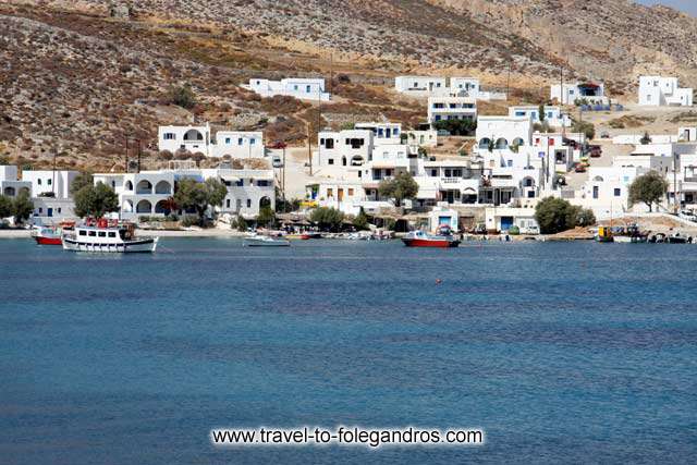 Boats in Karavostassis - View of the fishing boats in Karavostassis bay and  Chochlidia beach on the background