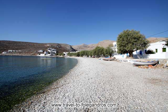 Chochlidia beach - Pine trees and boats on Chochlidia beach by Ioannis Matrozos